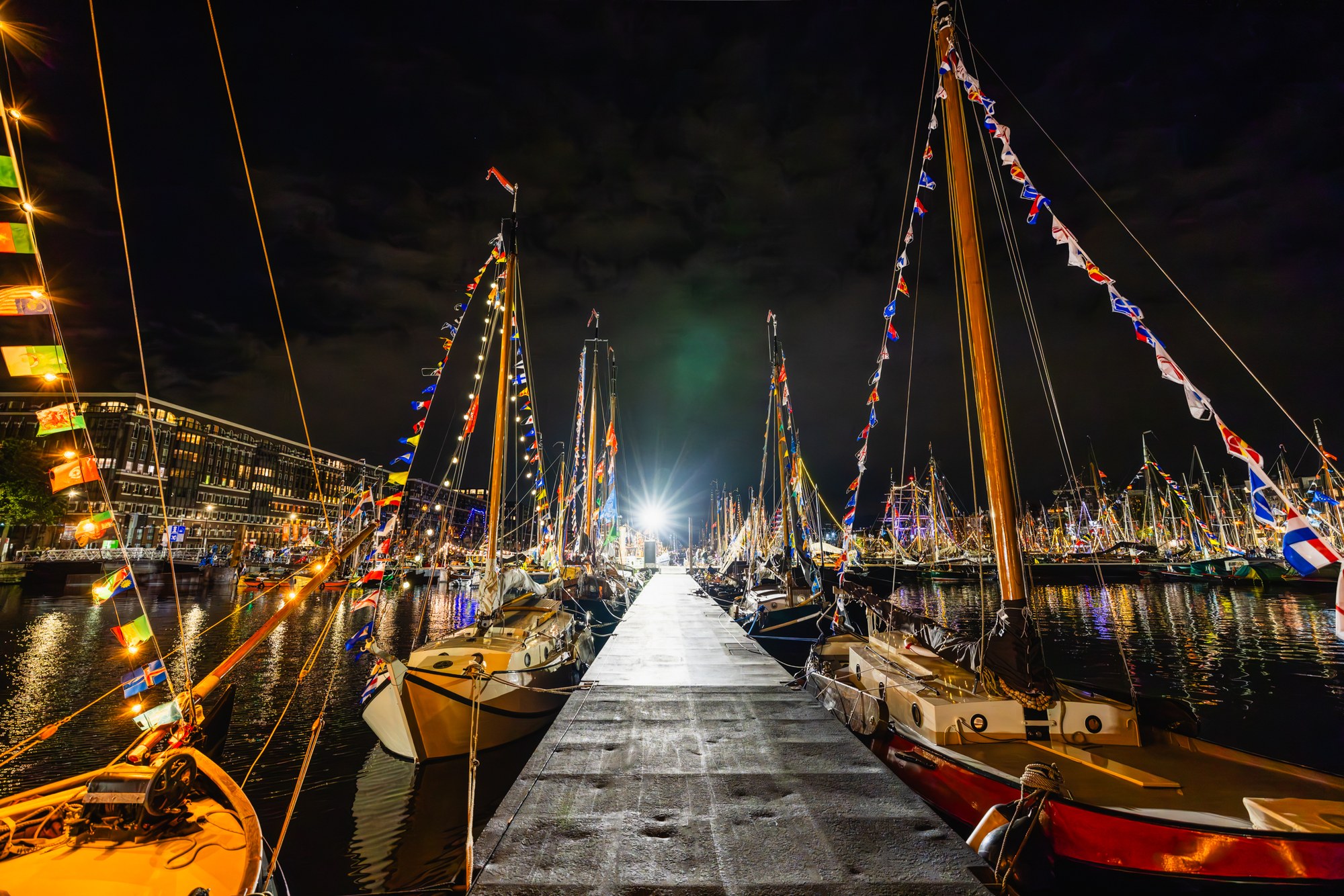 Illuminated tall ships at night, SAIL Amsterdam