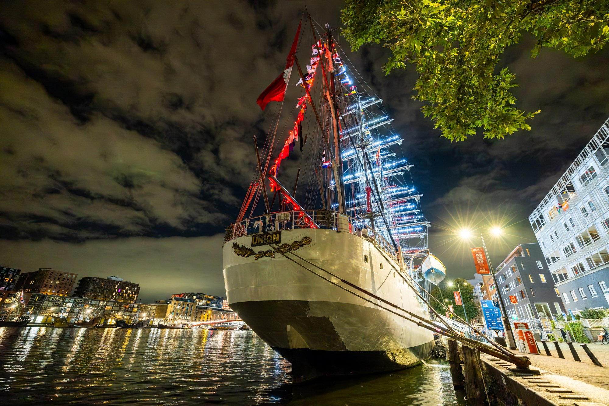 Illuminated tall ships at night, SAIL Amsterdam